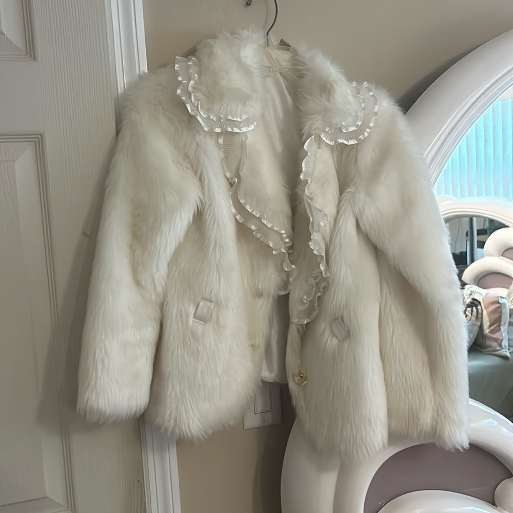 A white fur jacket that I got from Europe